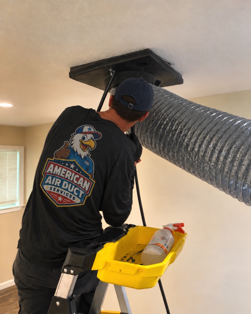 American Air Duct Services technician cleaning a home air duct in Houston